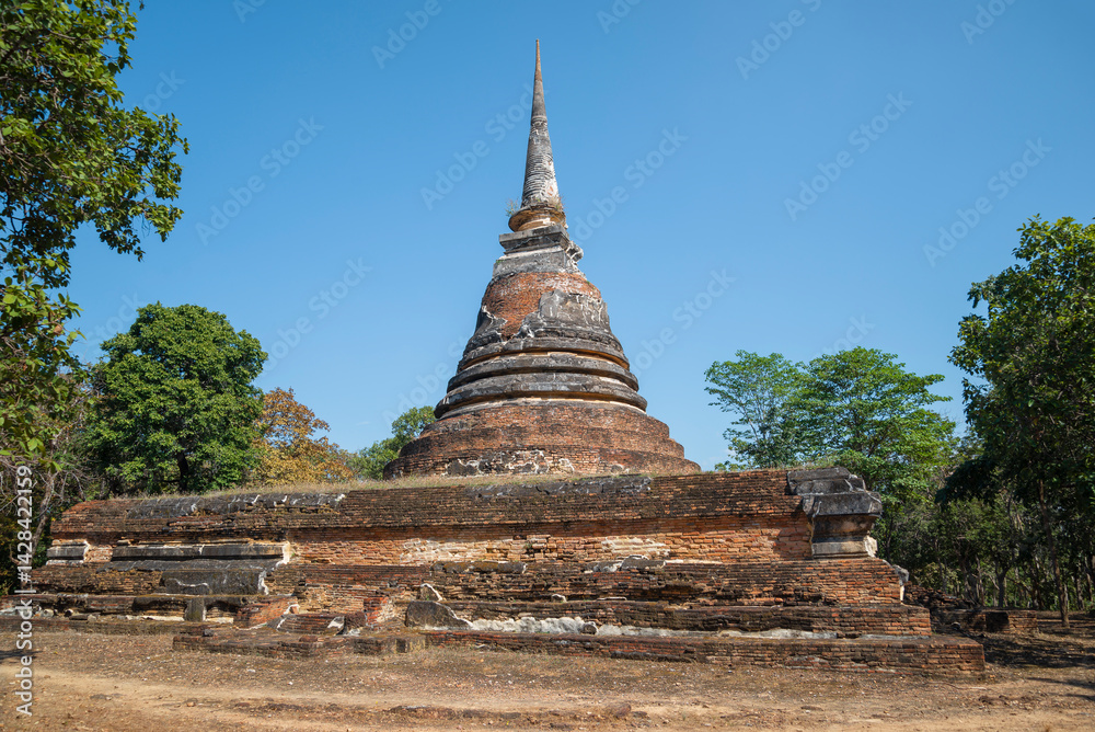 Buddhist stupa on the ruins of the ancient Buddhist temple Wat Chedi Ngarm. Sukhothai, Thailand