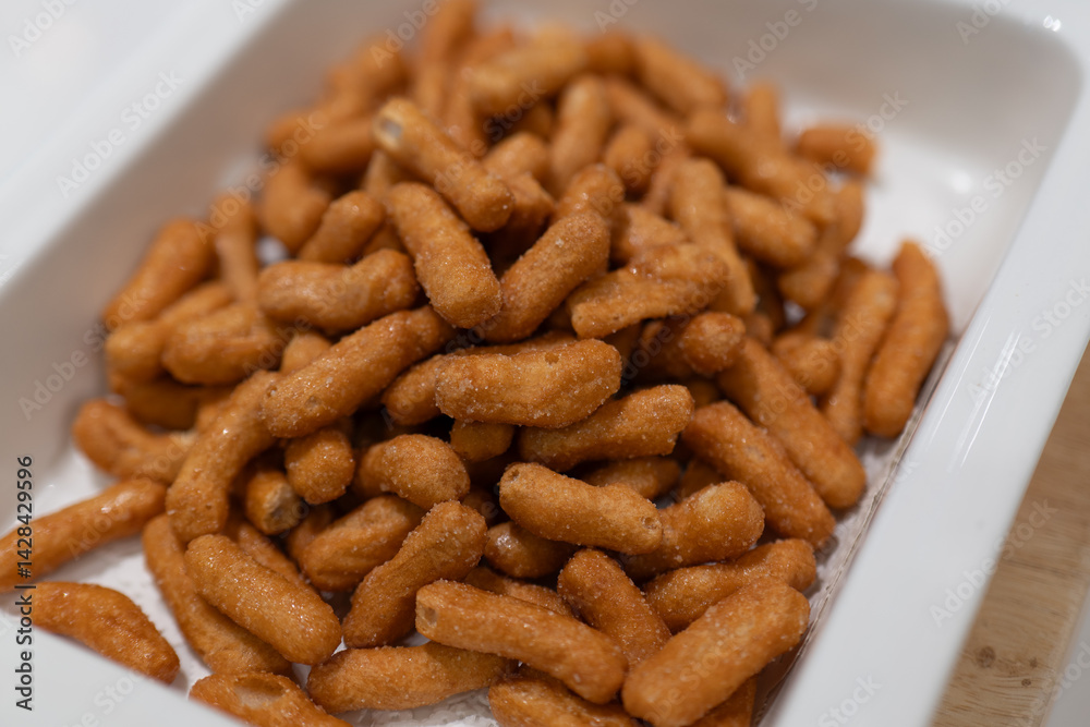 Crispy Savory Snacks in White Square Plate, Perfect for Relaxing Moments Crispy Savory Snacks in White Square Plate, Perfect for Relaxing Moments