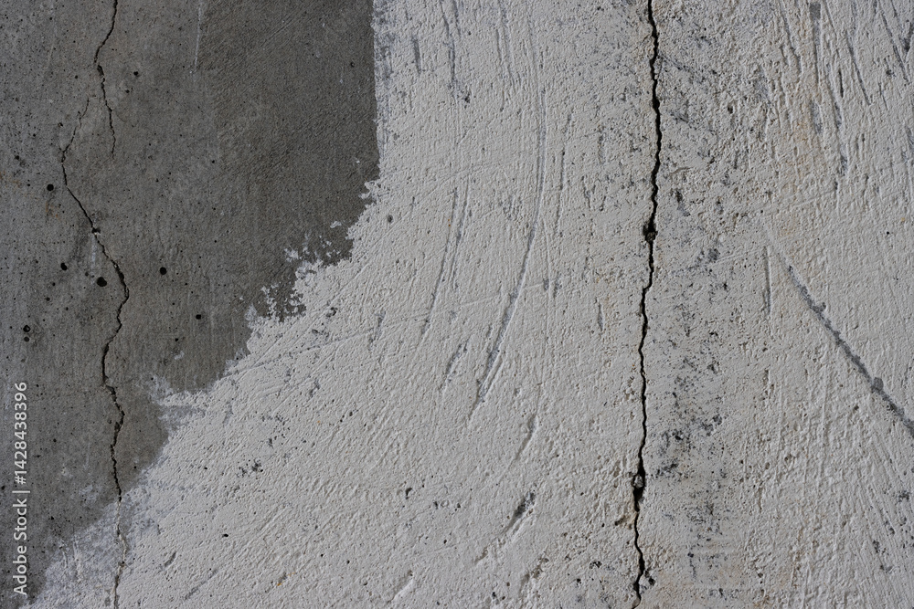 Texture of an old cracked concrete wall. Rough gray concrete surface. The gap between the reinforced concrete slabs. Perfect for background and design. Close-up. High resolution.