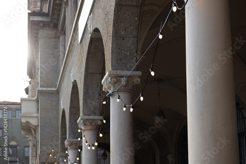 Obraz na płótnie Decorative vintage street black light bulbs with white shade. Outdoor Street electric garland. Old light bulbs. String wired bulbs. Festoon string lights decoration at the party event. w salonie