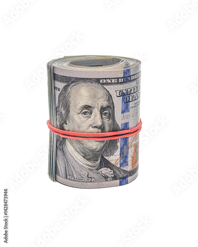 A tightly rolled bundle of U.S. hundred-dollar bills secured with a red rubber band is displayed against a white background, with Benjamin Franklins face.