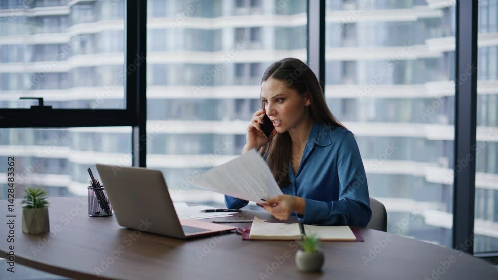 Corporate leader arguing cellphone frustrated document mistake in office. Corporate leader arguing cellphone frustrated document mistake in office.