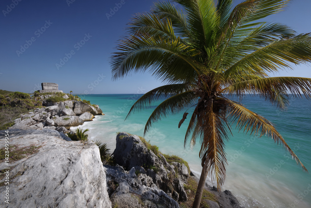 Fototapeta premium Tropical beach with white sand palm trees and ancient ruins