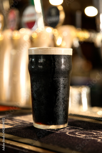 Pint of guinness on a bar