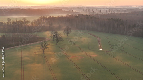 Foto Tractor tracks in a rural landscape from above