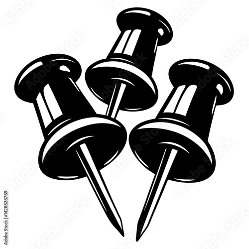Three glossy black and white push pins clustered together on a white background