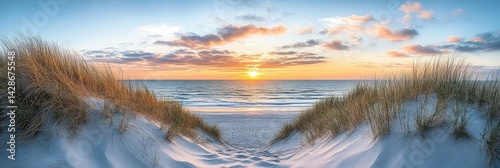 Coastline beach landscape with white sand dunes and grasses against scenic ocean sunset