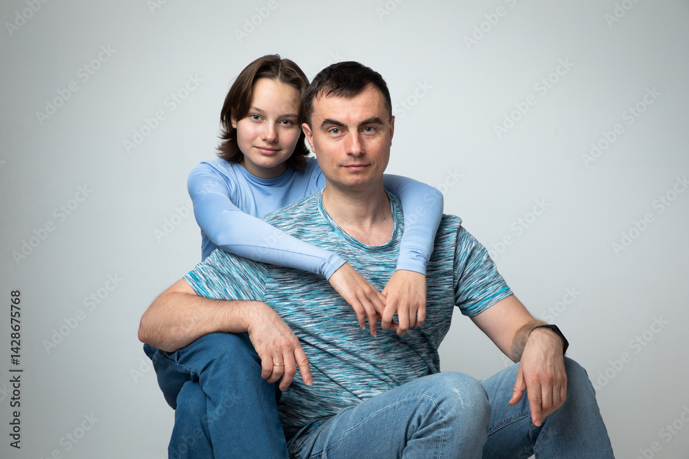 Studio portrait of family: father and daughter
