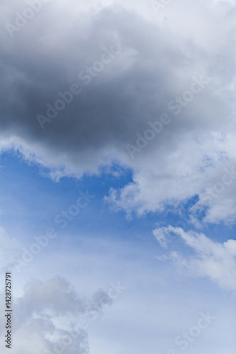 Wallpaper Mural Blue spot of sky appearing through cloudy grey sky after rain Torontodigital.ca