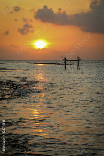 Beautiful sunset at Fulidhoo beach island in Maldives