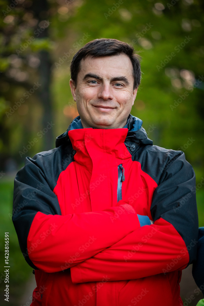 Portrait of handsome man outdoors in park in spring.