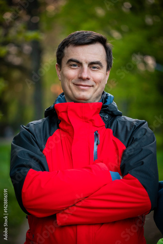 Obraz na płótnie Portrait of handsome man outdoors in park in spring. w salonie