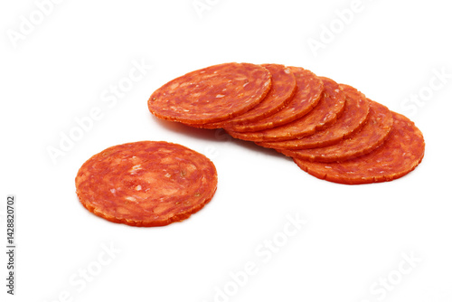 Fotografie Pile of pepperoni slices on white background