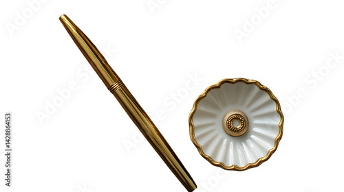 Flatlay of gold pen, ring dish, and linen napkin on wood table