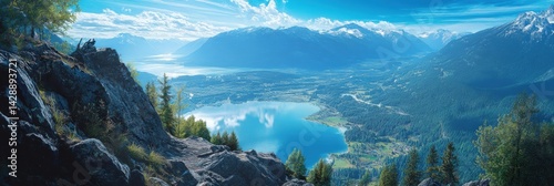 Breathtaking view from a mountain summit overlooking Slocan Lake and the stunning mountain range in British Columbia Canada photo