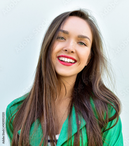 Fashion portrait stylish pretty woman outdoor. Young smiling woman. Street fashion. Red lipstick.