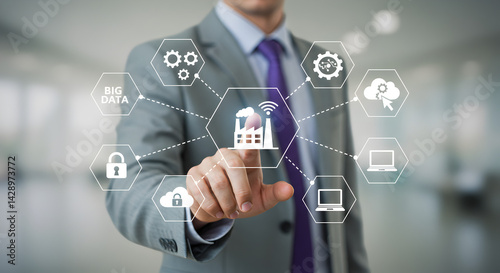 Businessman in Suit Touching Digital Industry Interface Displaying Industry 4 0 and Smart Factory in Blurred Background