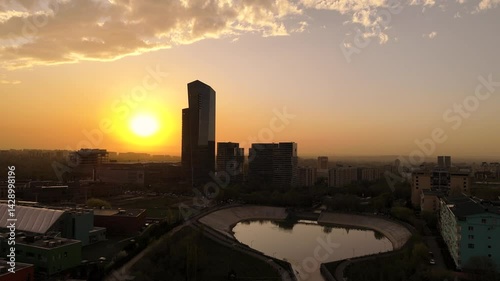 View of the tallest building in Almaty at sunset photo