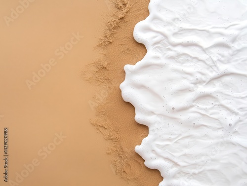 Tide water meeting dry sand with harsh abstract borderlines