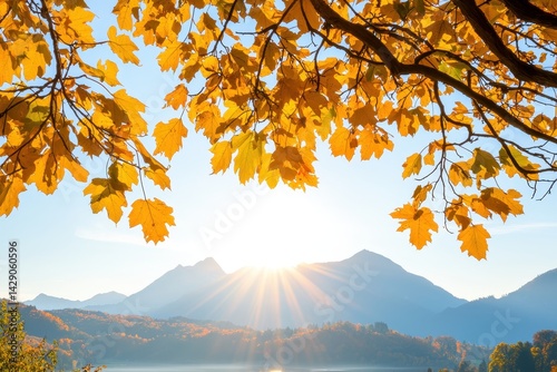 A serene landscape featuring autumn leaves framing a sunrise over a mountain range, showcasing vibrant colors and a peaceful atmosphere.