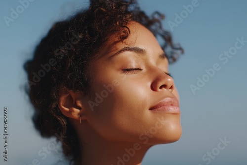 serene minimalistic portrait of individual enjoying onset of summer with blurred dreamy background