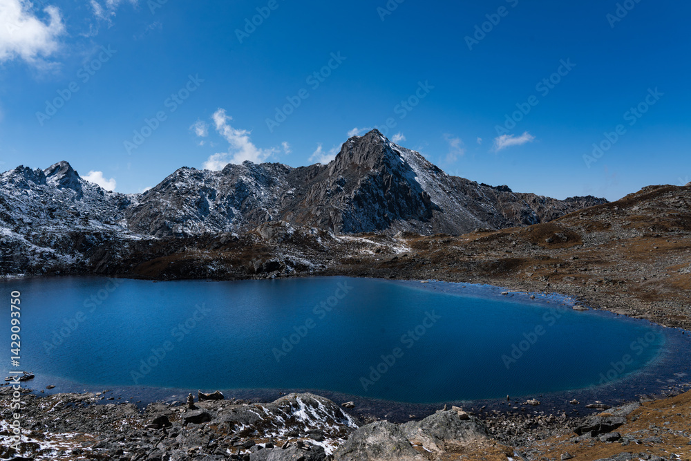 Naklejka premium Beautiful Glacial Lake in the Himalayas of Suryakunda, Langtang National Park, Gosaikunda, Nepal with Lauribina Pass View