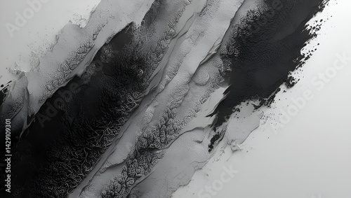 Monochrome granular surface with subtle noise and grainy abstract texture, creating a raw and tactile black and white backdrop photo