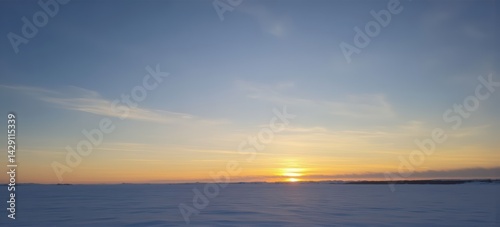 Stunning sunset over a snowy landscape, showcasing vibrant colors and serene beauty.