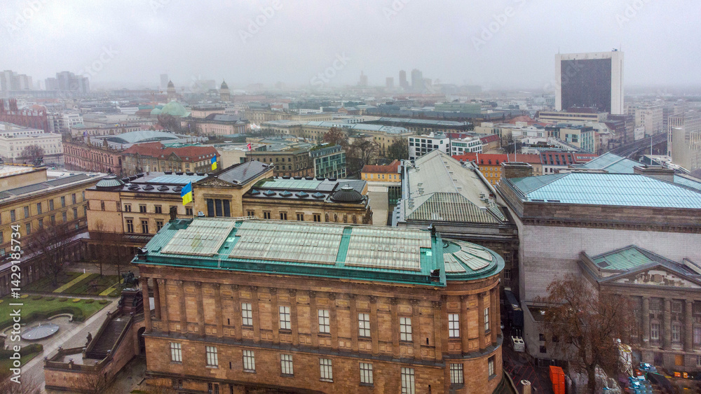 Drone point of view on Museum island and Ukrainian flags on them in Berlin