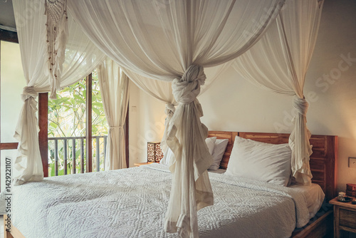 Obraz na plátně Traditional balinese cozy canopy bed