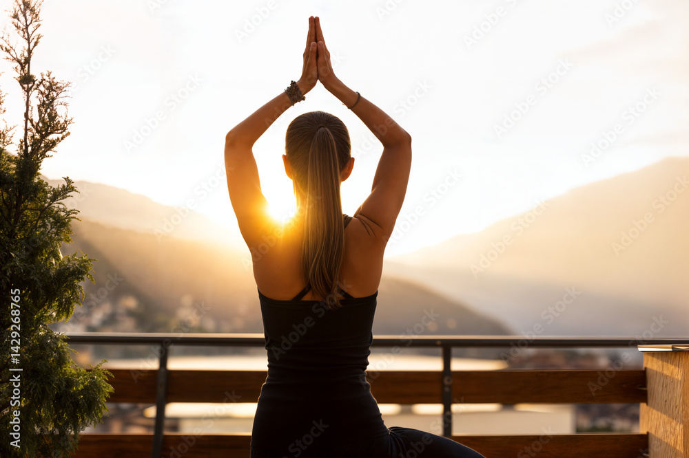 The image shows a person practicing yoga on a balcony with a beautiful sunset in the background