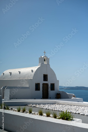 A traditional Orthodox church in Oia village in Santorini island, Greece