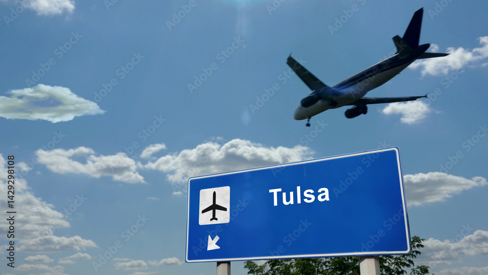 Plane landing in Tulsa Oklahoma, USA, airport with signboard