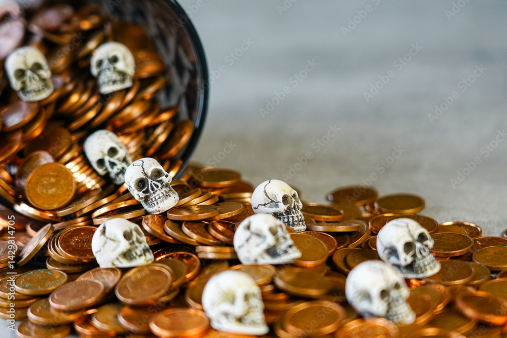 Concept of the tragedy of hoarding money and wealth, skulls on a pile of spilled money Concept of the tragedy of hoarding money and wealth, skulls on a pile of spilled money