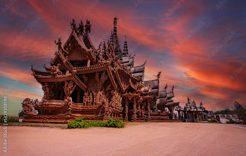 The Beautiful Landmark view of a sculpture of Sanctuary of Truth temple with blue sky background in Pattaya , Chonburi, Thailand.