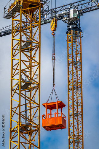 Wallpaper Mural Construction crane reaches to the sky during a sunny afternoon in an urban area with bright blue skies Torontodigital.ca