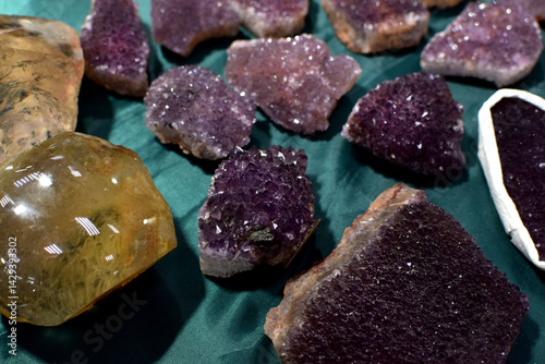 Beautiful amethyst crystal cluster at a rock show. Natural purple amethyst druse at a rock fair