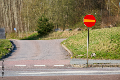 No entry traffic sign at rural roadside.