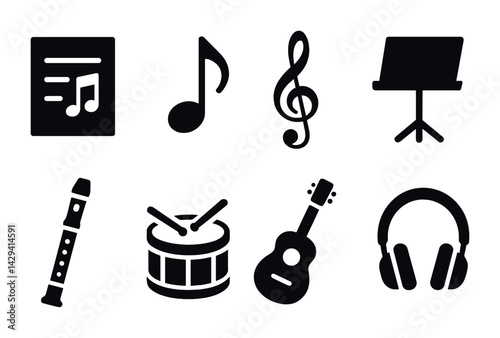 Music education solid icons set – filled style musical instruments and learning symbols for classroom resources: music sheet, note, treble clef, music stand, recorder, drum, guitar, headphones.
