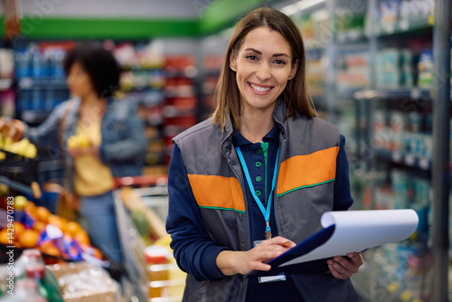 Portrait of happy supermarket manager looking at camera.
