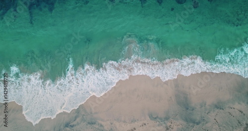 Obraz na płótnie Capturing stunning aerial views of turquoise waters gently lapping the pristine sands of Bias Tugel Beach, a hidden Bali gem, creates a breathtaking tropical paradise w salonie