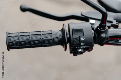 black motorcycle right handlebar handle closeup view
