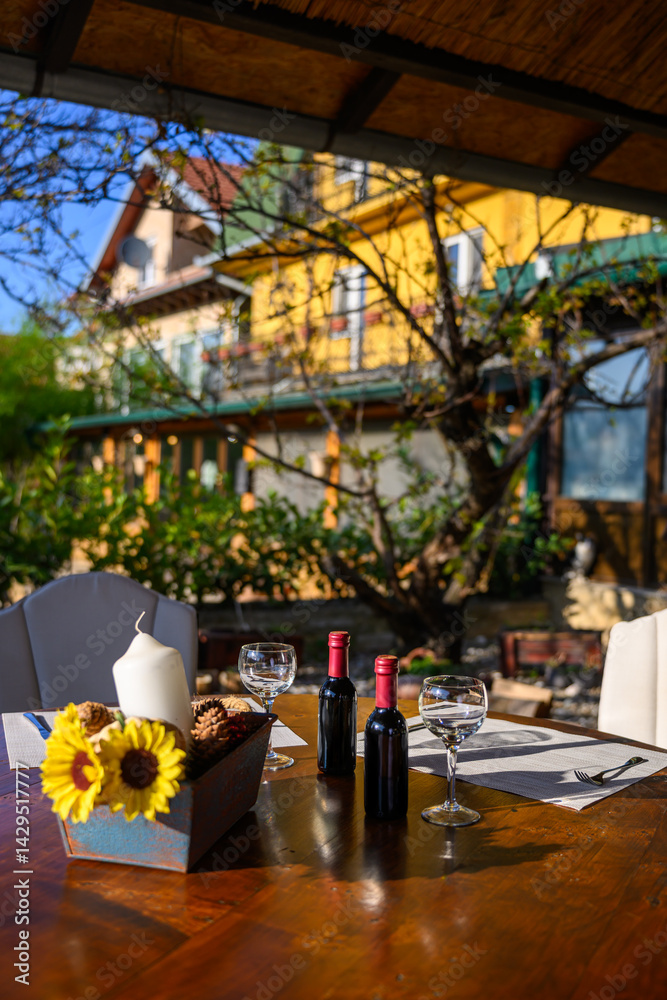 Decorative table with wine and sunflowers