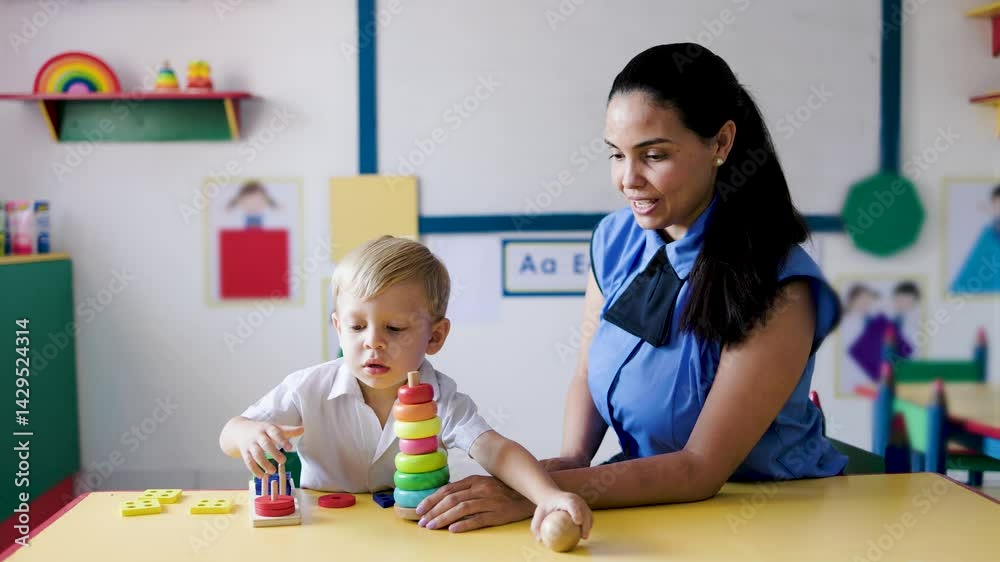 Education, Teacher helps kid play with wooden toys at pre school class room. Kindergarten, smart and development games for children