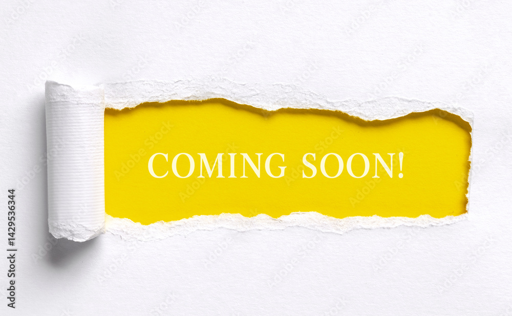 Coming soon text message on yellow background with torn paper edge announcement or promotion concept with copy space