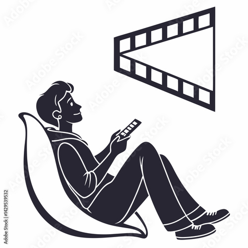 Young Man Relaxing On Beanbag Chair Watching Television With Remote Control