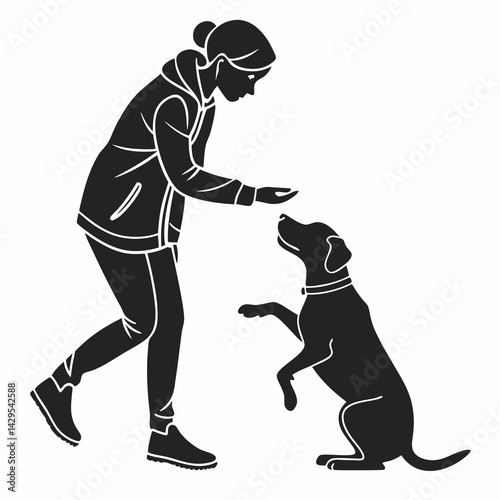 Silhouette Of Woman Training Dog With Treat For Positive Reinforcement Reward