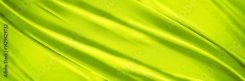 Obraz na płótnie Yellow green silk satin. Lime color shiny silky smooth fabric. Soft wavy fold lines. Elegant background. Curtain drapary. Design. Bright. Light. Wide banner. Panoramic. Template. w salonie