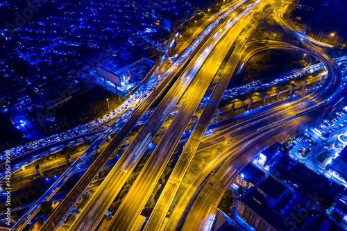 Aerial top view of transportation with Expressway, Road and Roundabout, multilevel junction traffic highway-Top view. Important infrastructure and transport in big city, Bangkok Thailand.