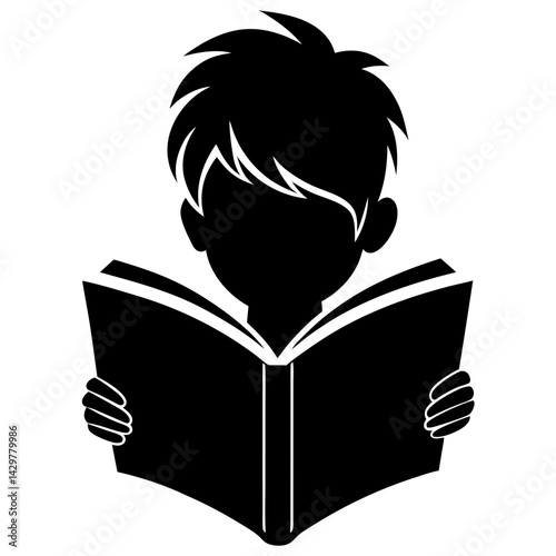 Silhouette of a boy reading an open book